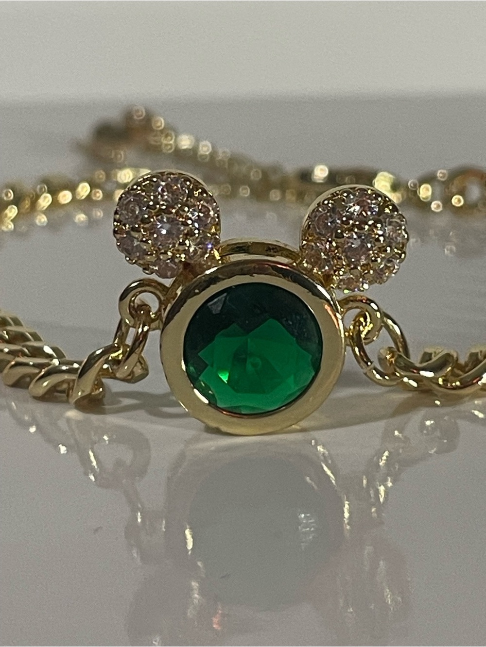 Disney Gold-Tone Necklace with Emerald Green Center and Sparkling Ears